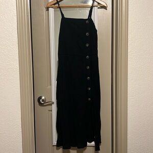 Black dress with tortoise buttons